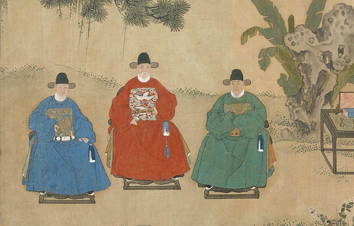 A group of men in traditional clothing
Description automatically generated
